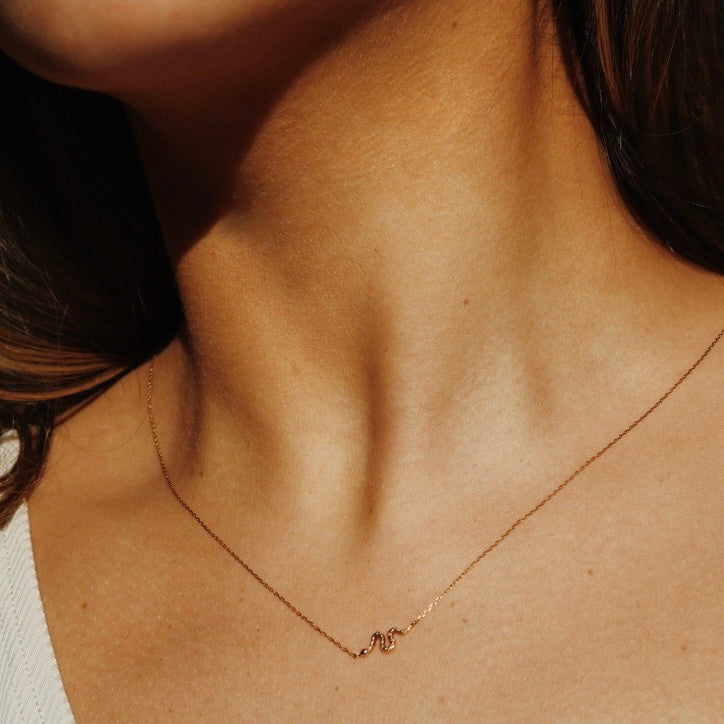 snake necklace dainty gold on neck