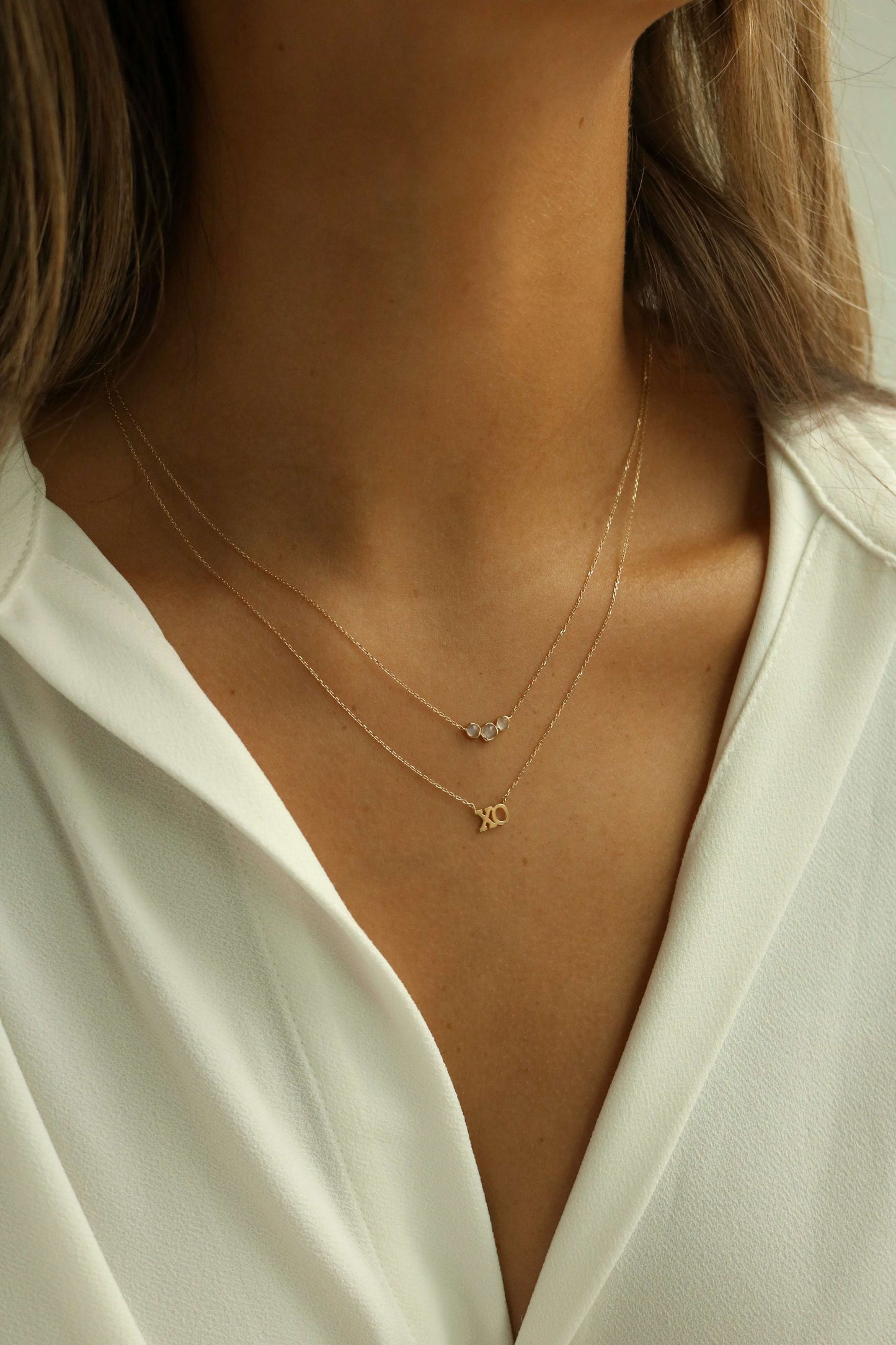 XOXO necklace layered with moonstone