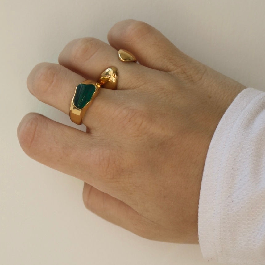 green stone agate ring on hand